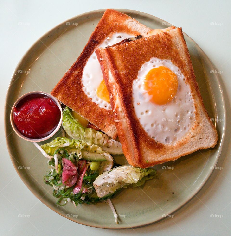 breakfast, fried toast with egg and chilli tomato sauce