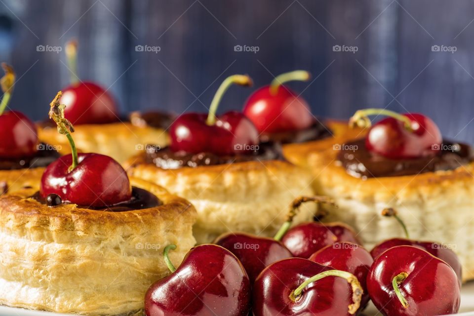 Vol-au-vents filled with dark chocolate and cherry