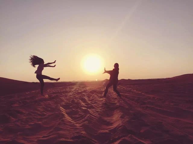 Two girl play toy together in the beach.
