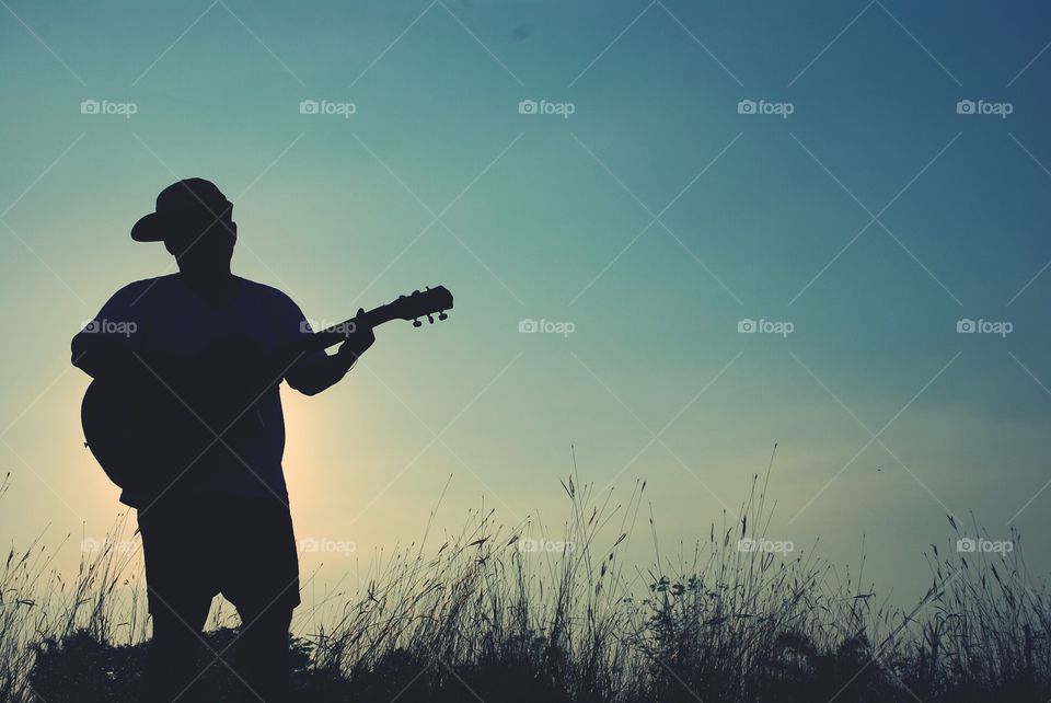 beautiful a man playing acoustic guitar.