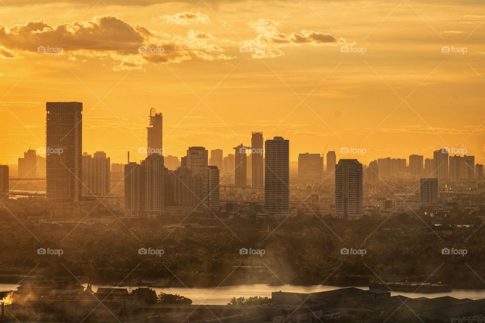 Golden twilight cover silhouette skyscraper in Bangkok