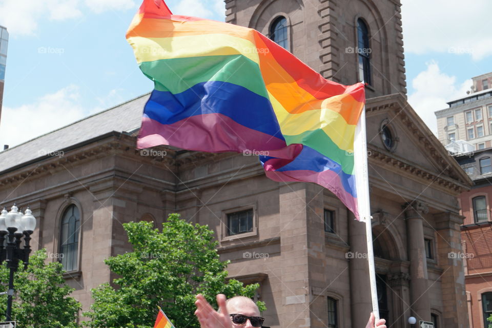 A huge LGBT flag at the pride parade in Boston, MA June 2017