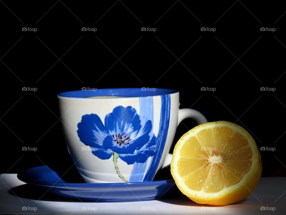 A cup of tea with lemon