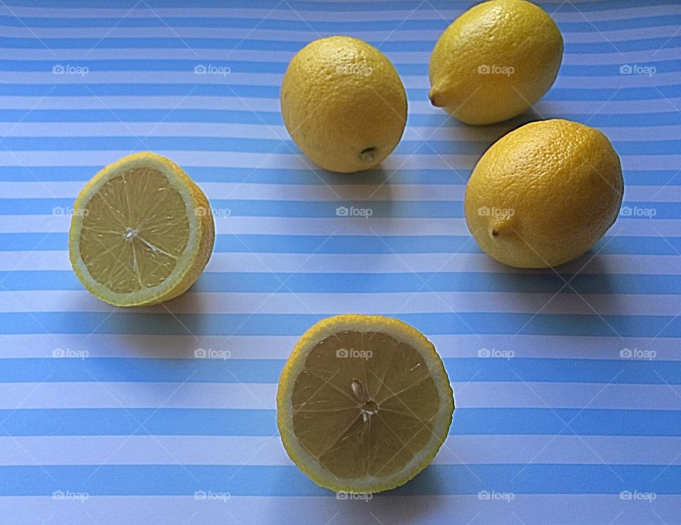 Cutting lemons to make lemonade 