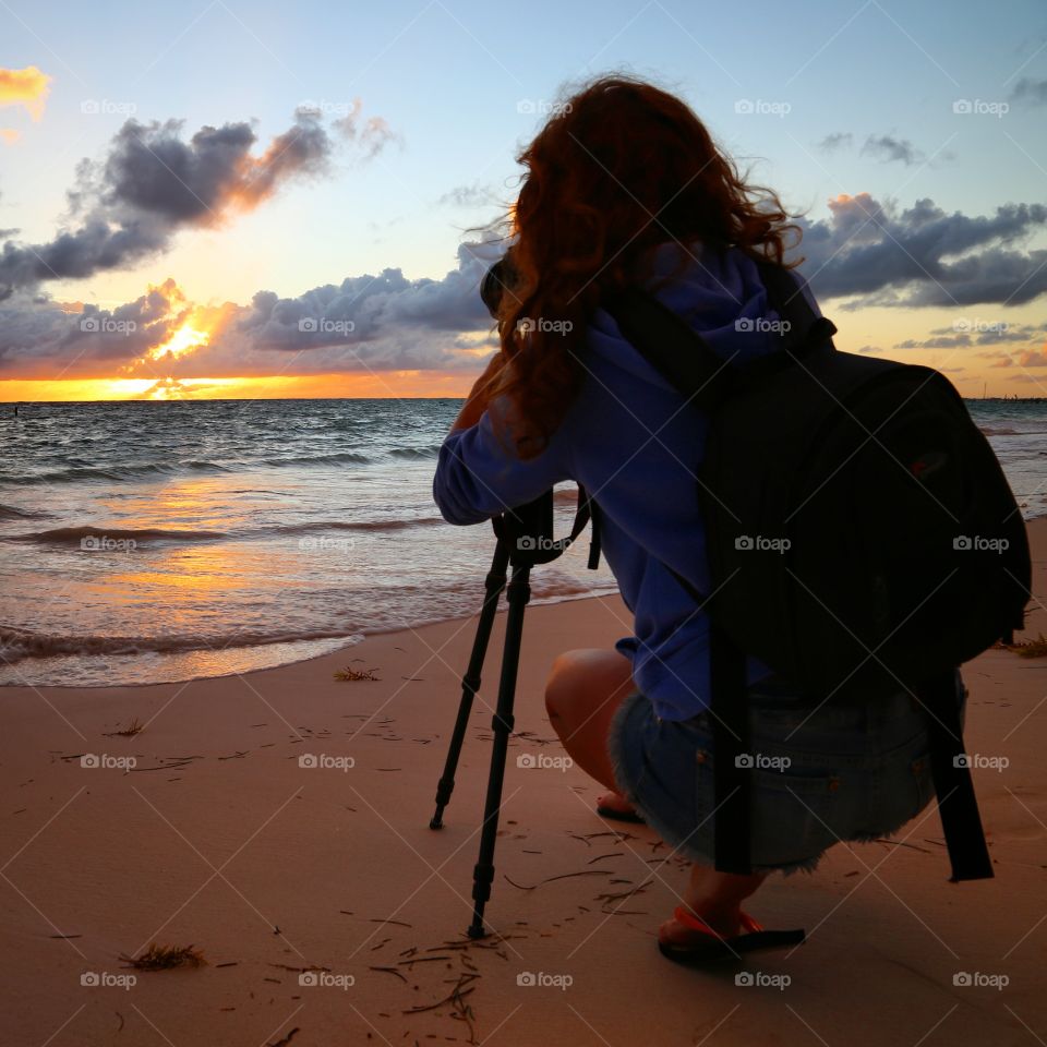 Female photographer at the sunrise