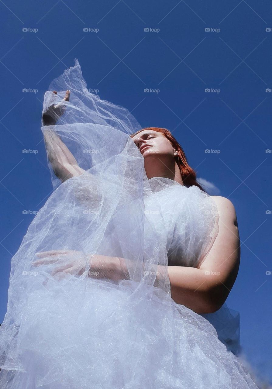 an original photo of a girl who enjoys the harmony of the air and her own body