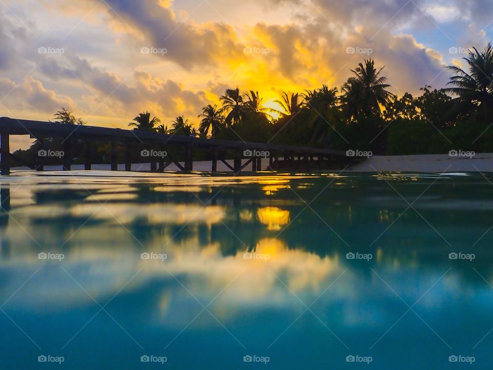 Swimming in the ocean while the sun sets 