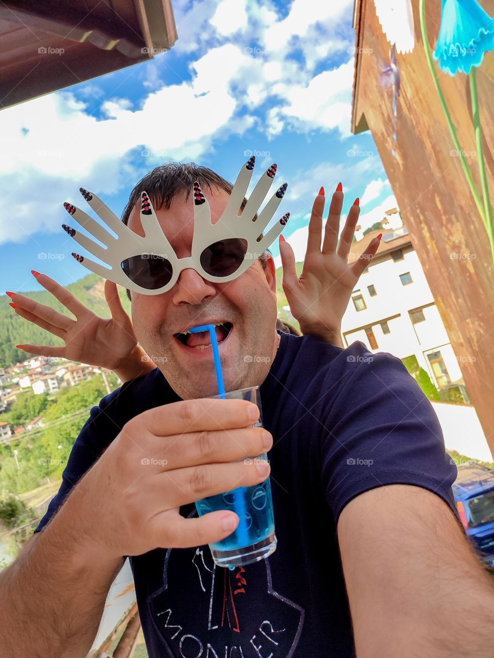 Energetic, Light-Hearted Funny Selfie with Cocktail and Sunglasses