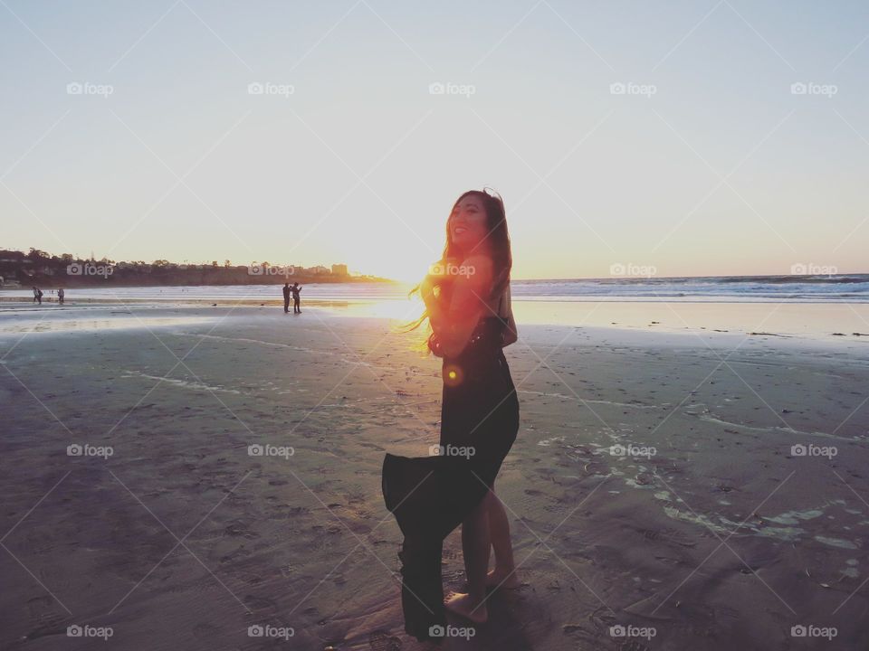 A photo of my beautiful self walking into the sunset while on the beach. Perfect for stock images of traveling girls and beach life blogs.