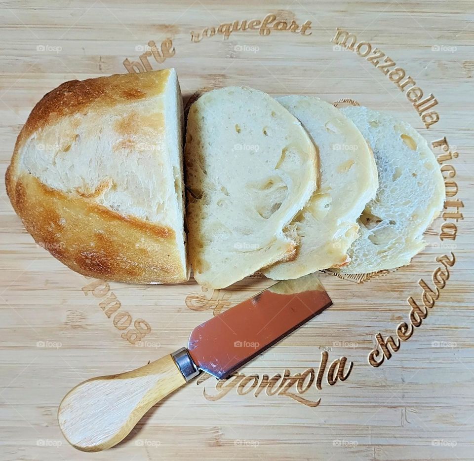 delicious handmade bread lying on a wooden cutting board