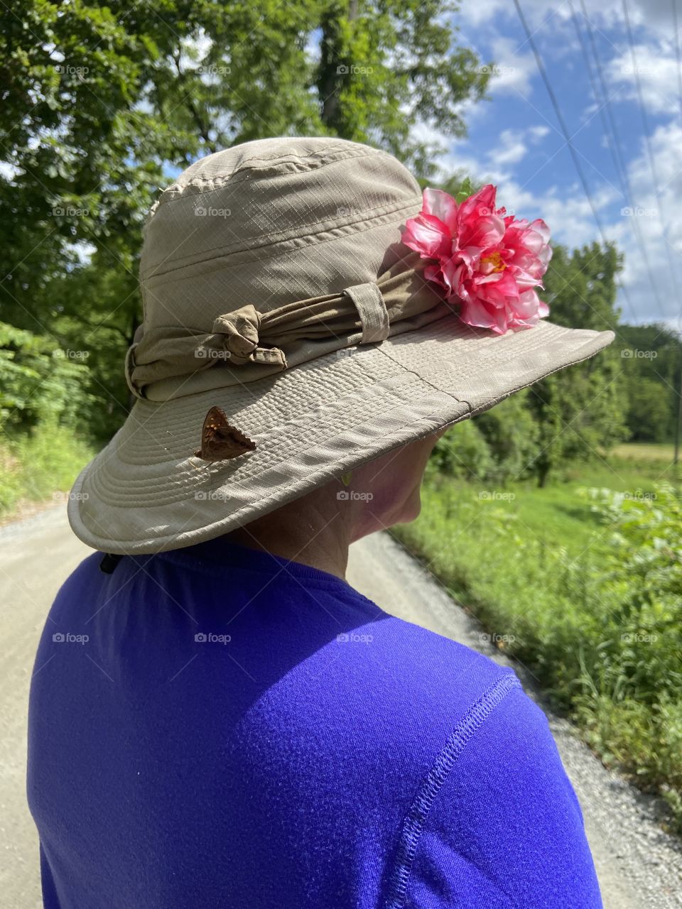 Woman, a hat and a butterfly 