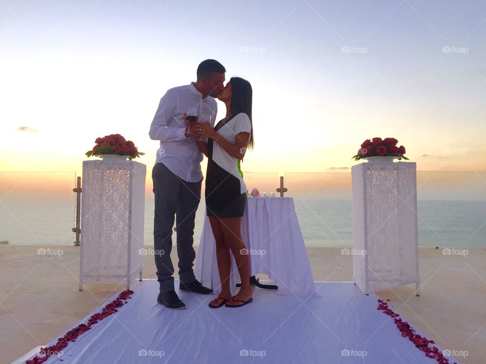 Couple kissing each other at sunset