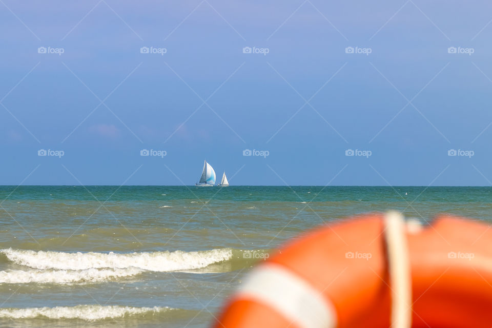 Vew from shore to sailing boats far to the sea, Italy, Riccione