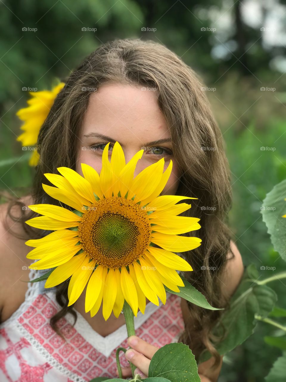 A girl and her sunflower 