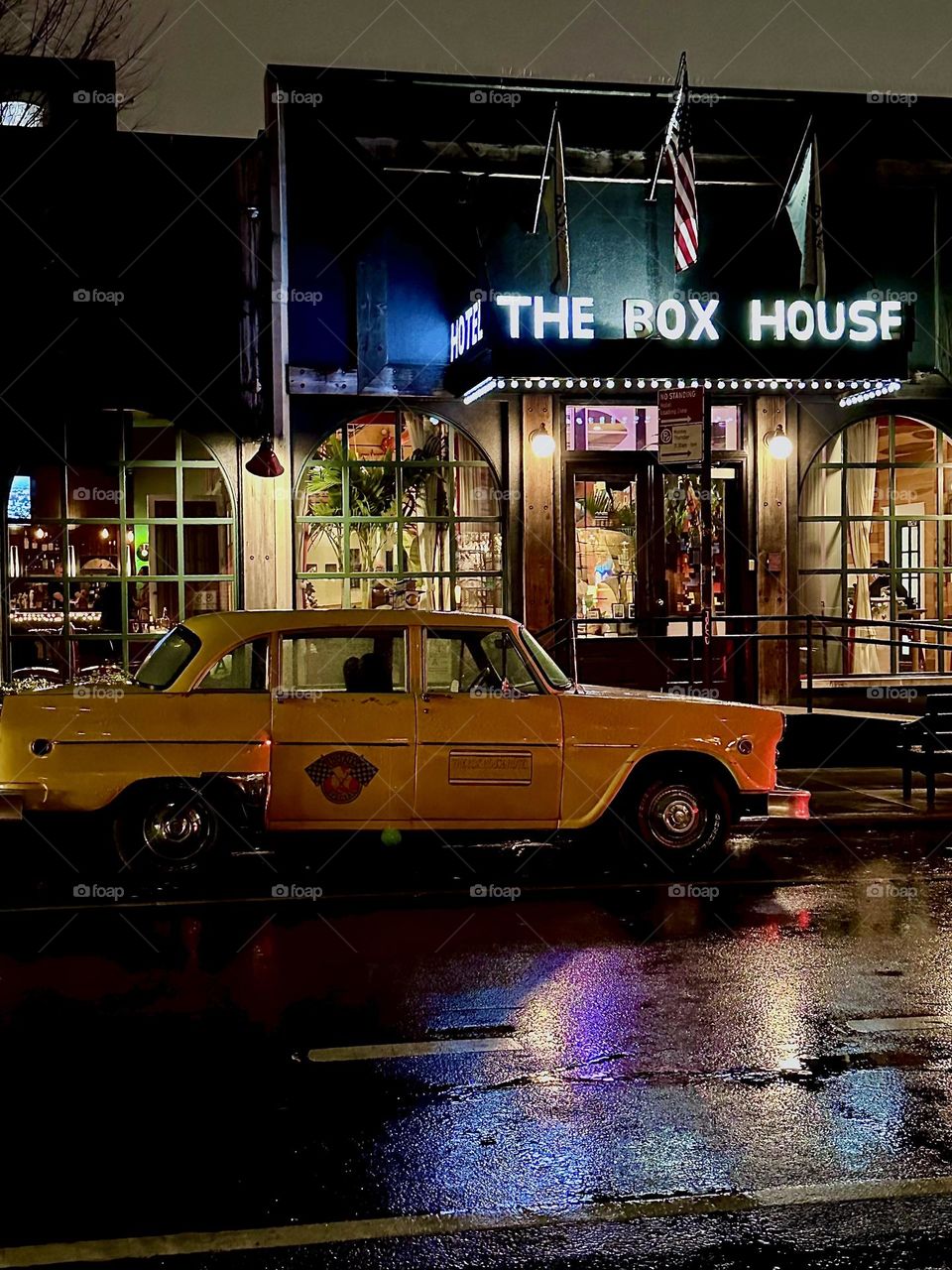 Extending over almost an entire city block “THE BOX HOUSE HOTEL”, a five story building on “Box St” in “Greenpoint”, Bklyn is likely the largest in the area. The elegant lobby has a yellow cab waiting outside at all times. 2023. Hypnotic Productions