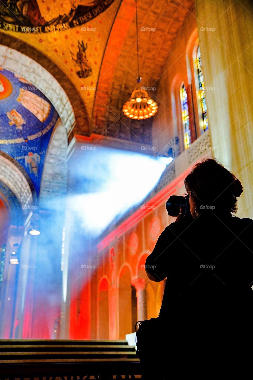 Photographer at work in a cathedral 