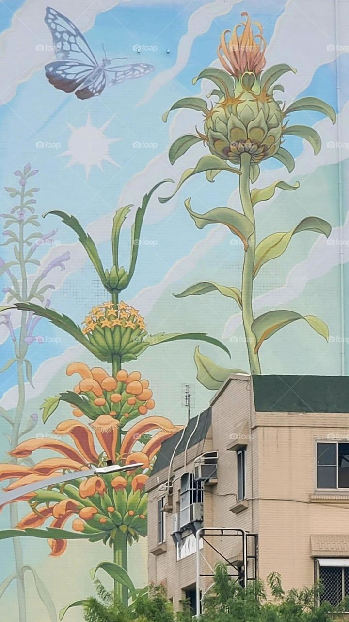 There is s large mural on the building