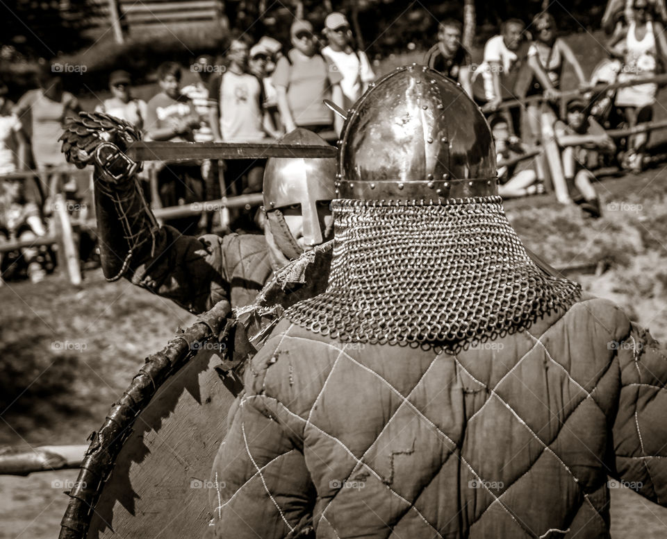 Duel of two knights. Fight betwen two armoured warriors from early medieval on the fest.