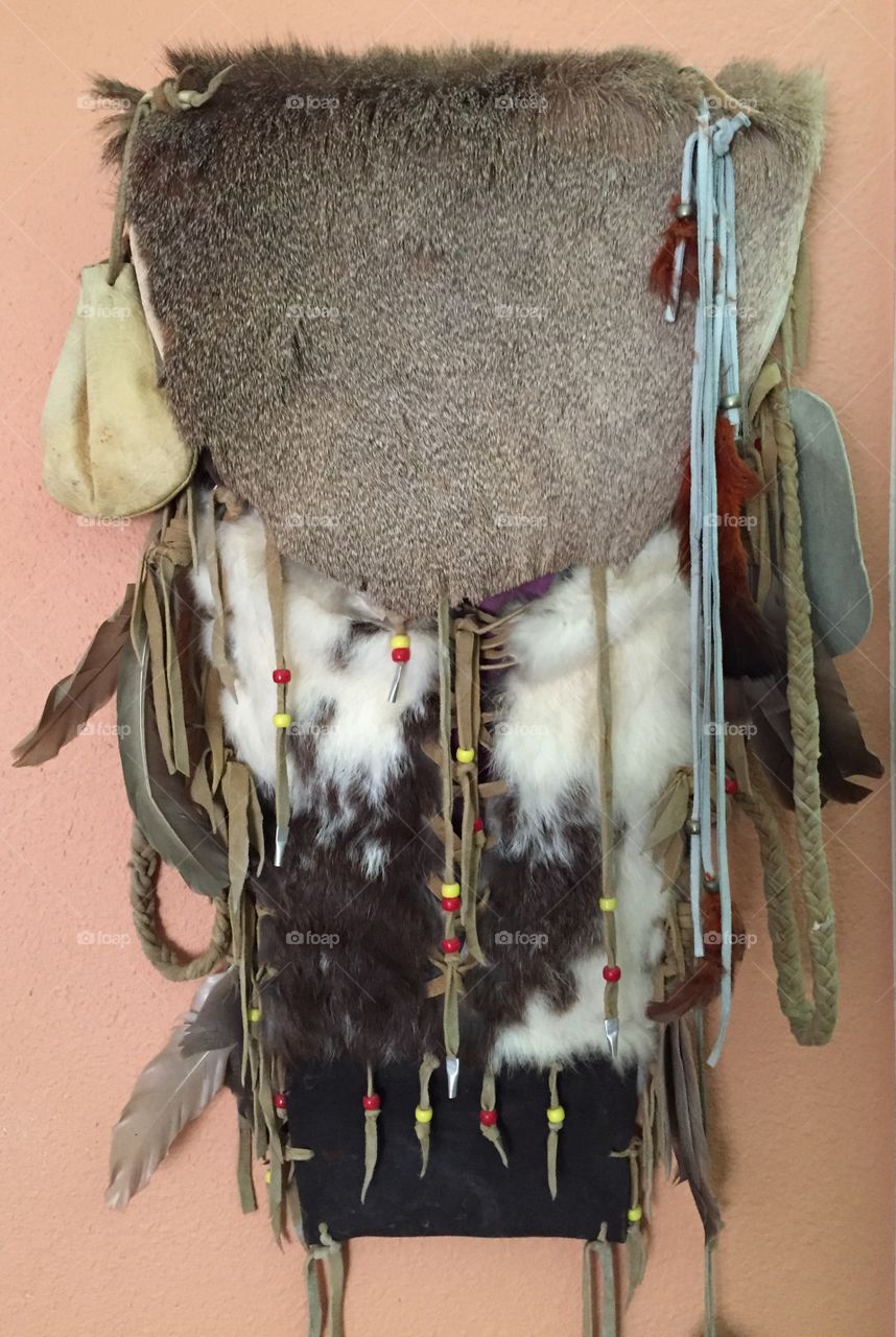 Indian wall art. Native American wall hanging in fur, leather and feathers 