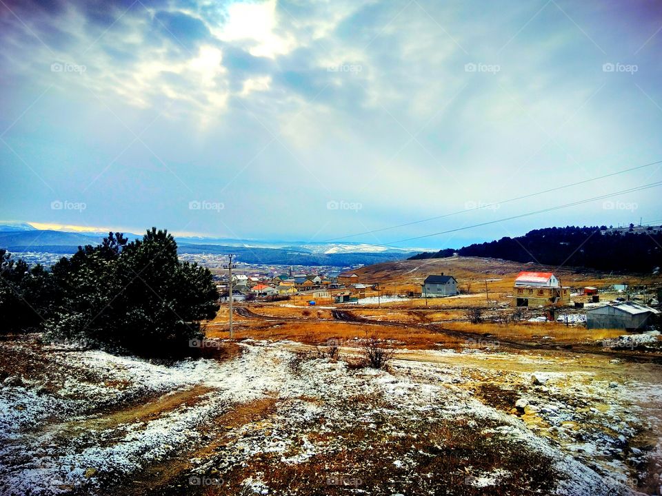 village distant view of mountains, forests