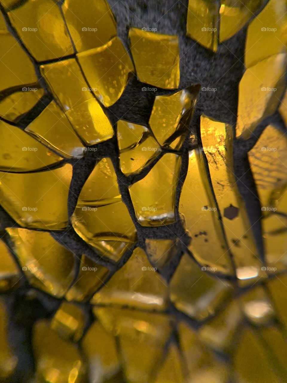 Macro lens fun. A Christmas night light that looks like an old street lamp. With crackled yellow glass. 