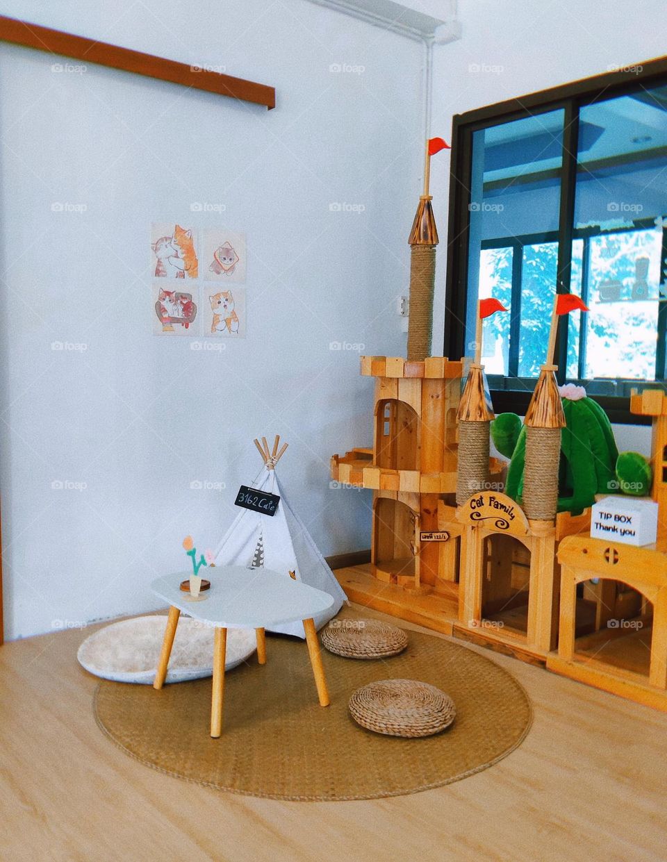 The cafe has a castle for cats.