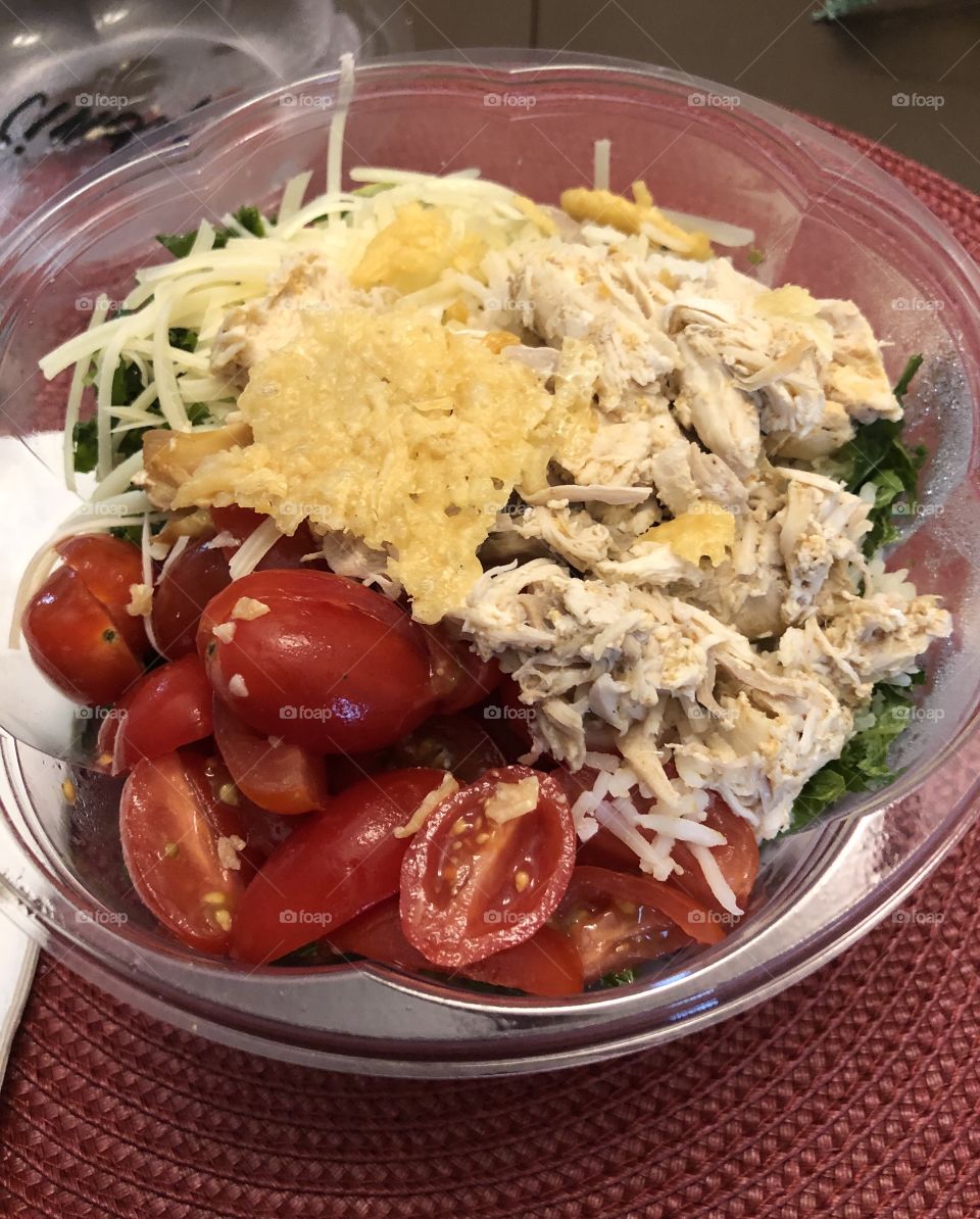 Chicken Caesar salad with organic kale lettuce grape tomatoes fresh Parmesan rice 