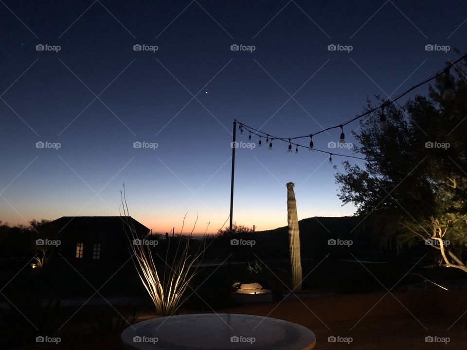 A stunning desert sunset in Tucson, Arizona featuring a bright evening star. 