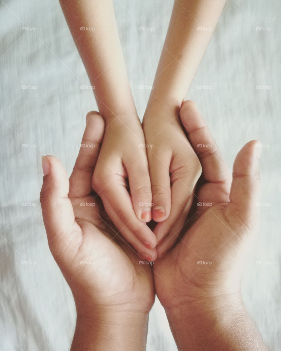 Man holding woman's hands