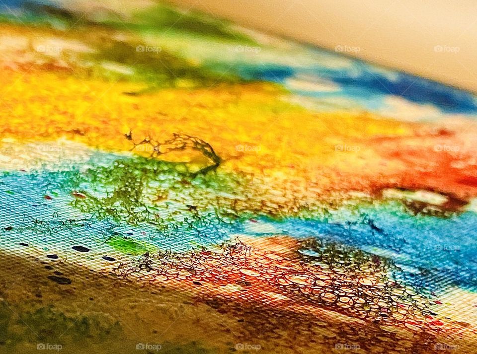 3D details on a painted canvas made with shaving cream and soap