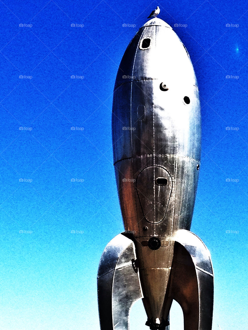 Shining chrome retro sci-fi rocketship