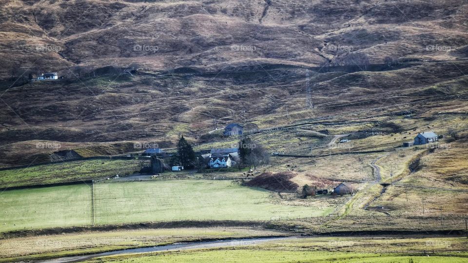 Houses at the bottom of a mountain