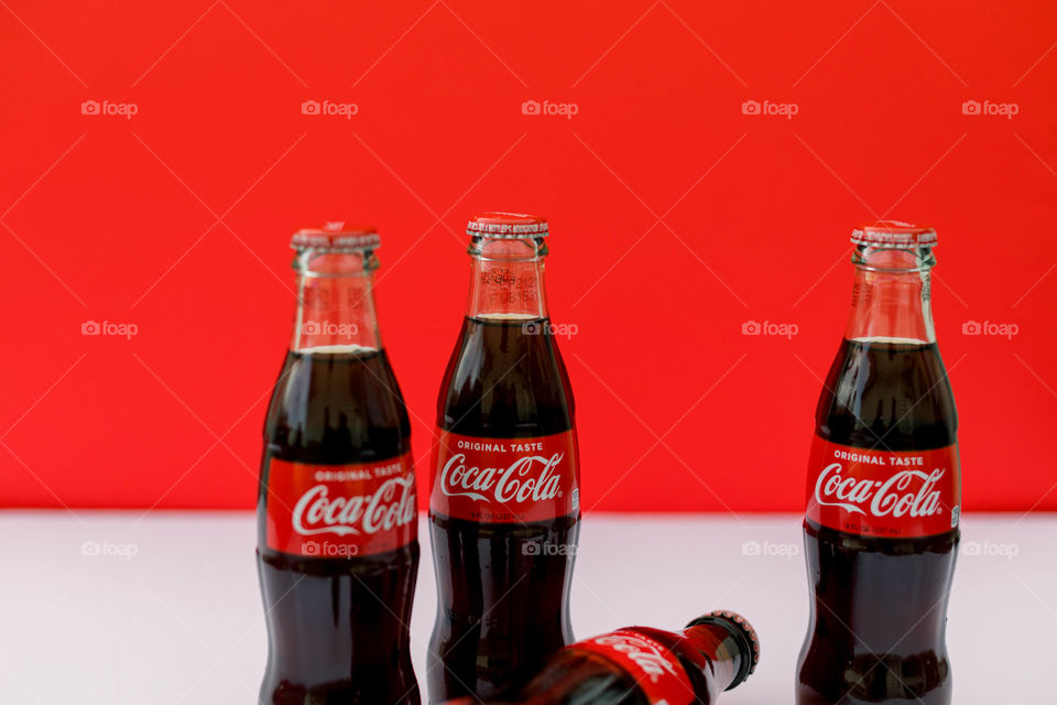 Coca-Cola on white and red background 