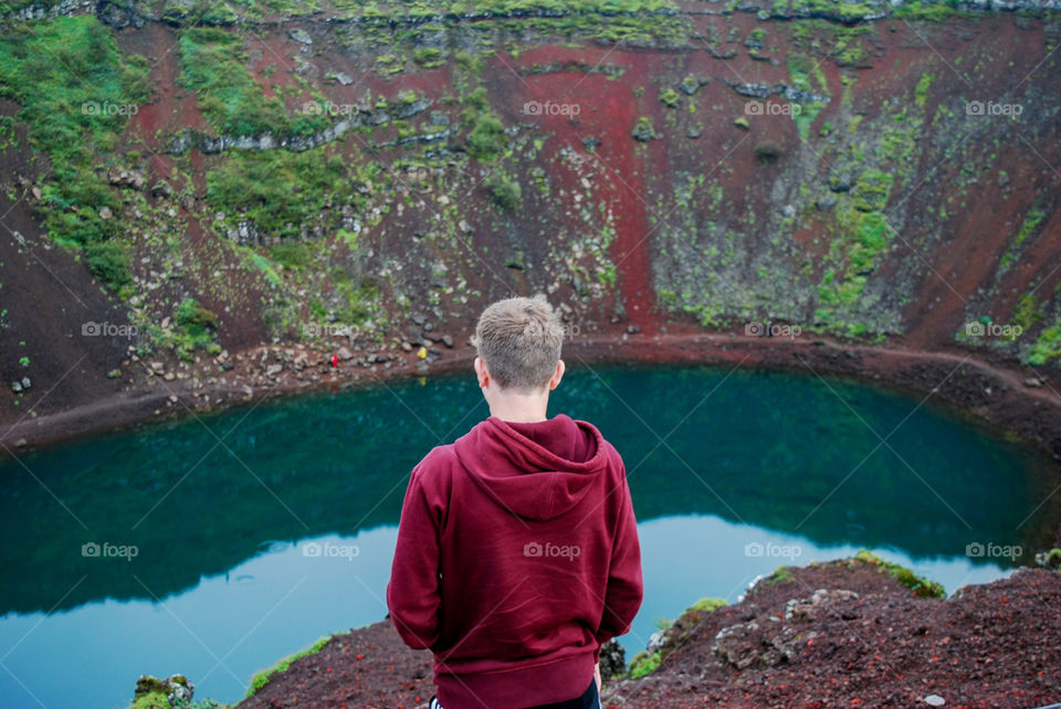 A boy looking out over the Kerid Crater.