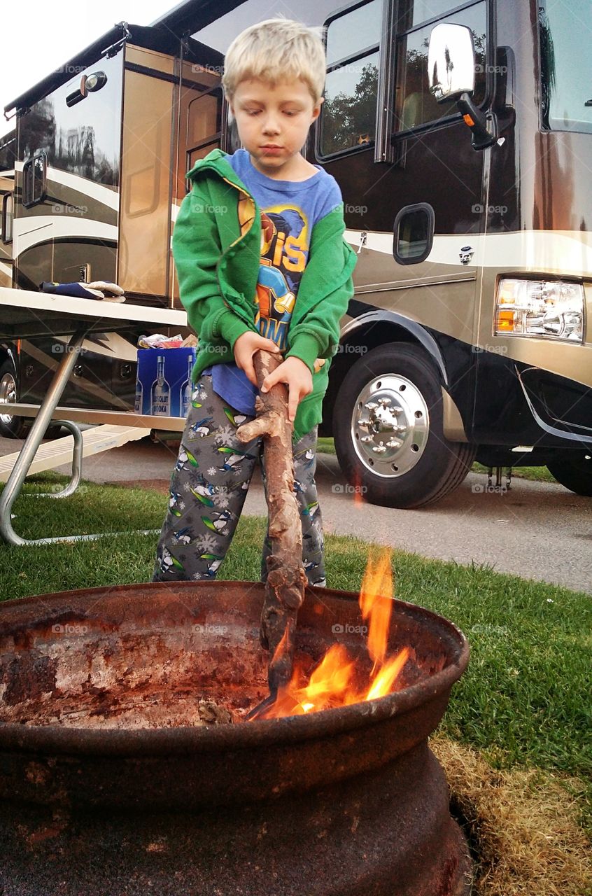 Camping Elf. He loves to help safely with the fire while camping. A cold night, a fire, and some hot chocolate makes for a great family trip.