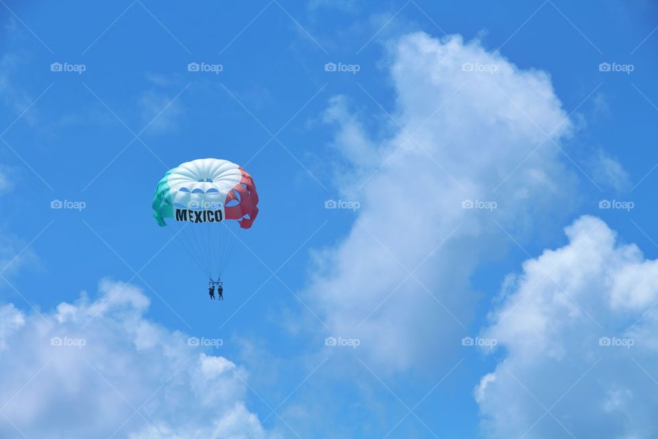 mexican paragliding flying at sky