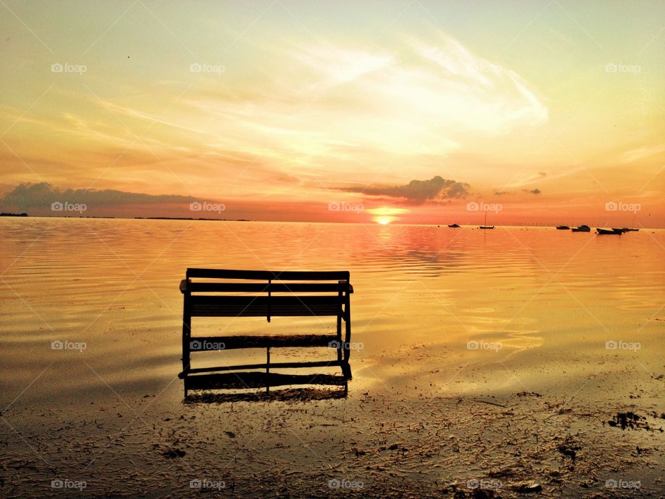 Bench in sunset