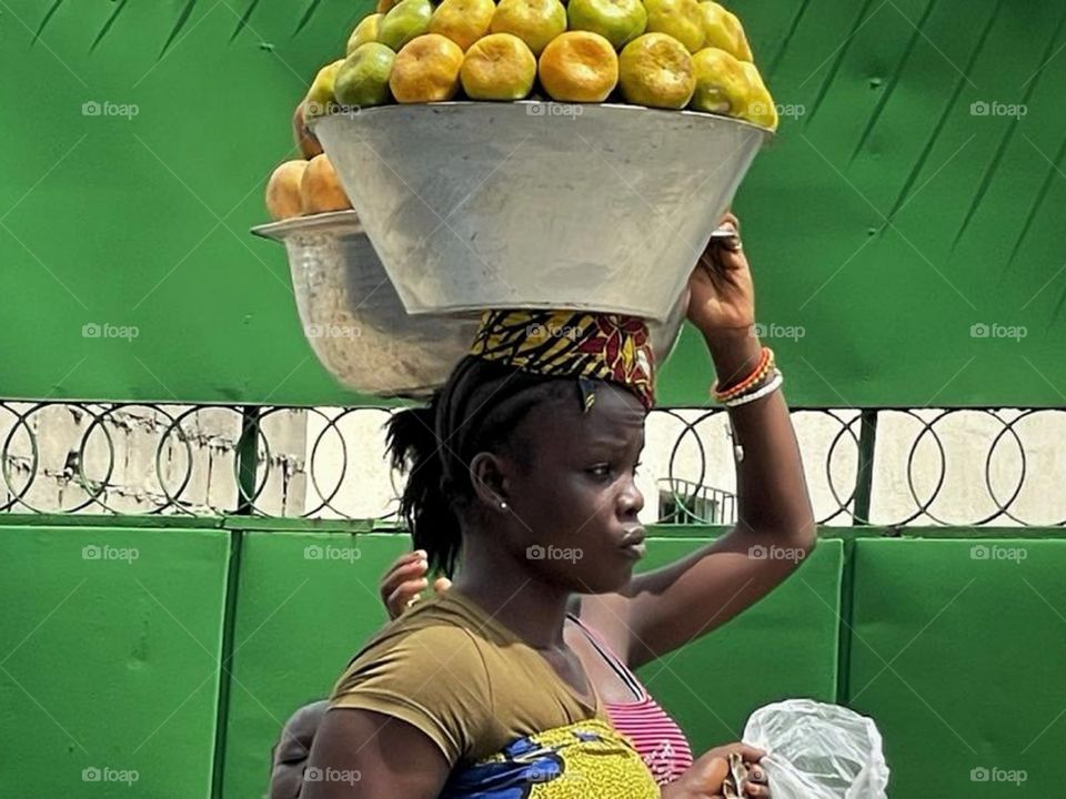 Women selling fruits in the streets of Abidjan.