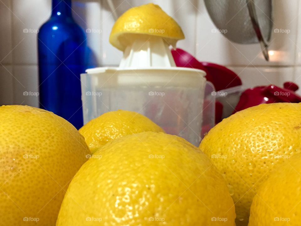 Fresh lemons off the tree squeezing lemons for lemonade