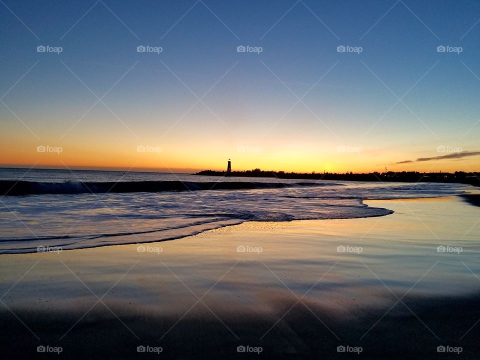 Colorful lighthouse sunset at Santa Cruz