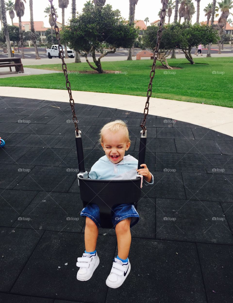 Cute child enjoying on swing 