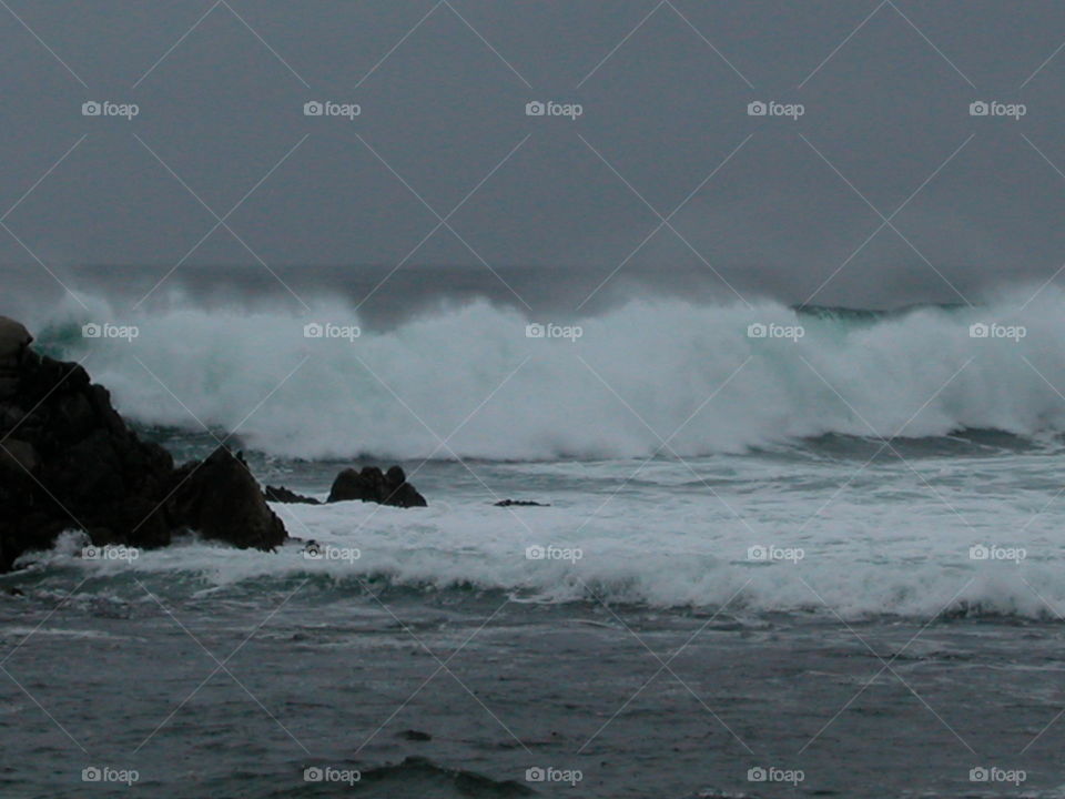 Waves smashing into rocks