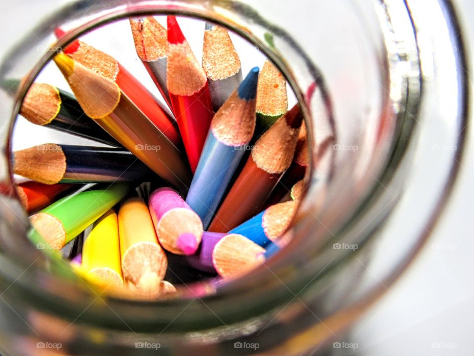 glassful of sharpened colored pencils