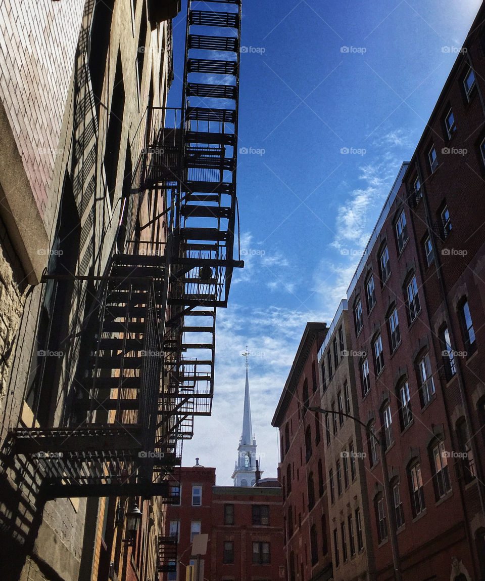 Boston’s Old North Church spire seen from an alley in the North End neighborhood 