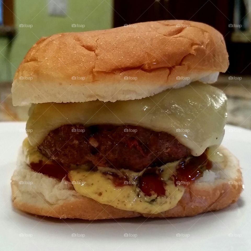 That's a Gouda Burger. My secret burger recipe with a a few slices of Gouda atop.
