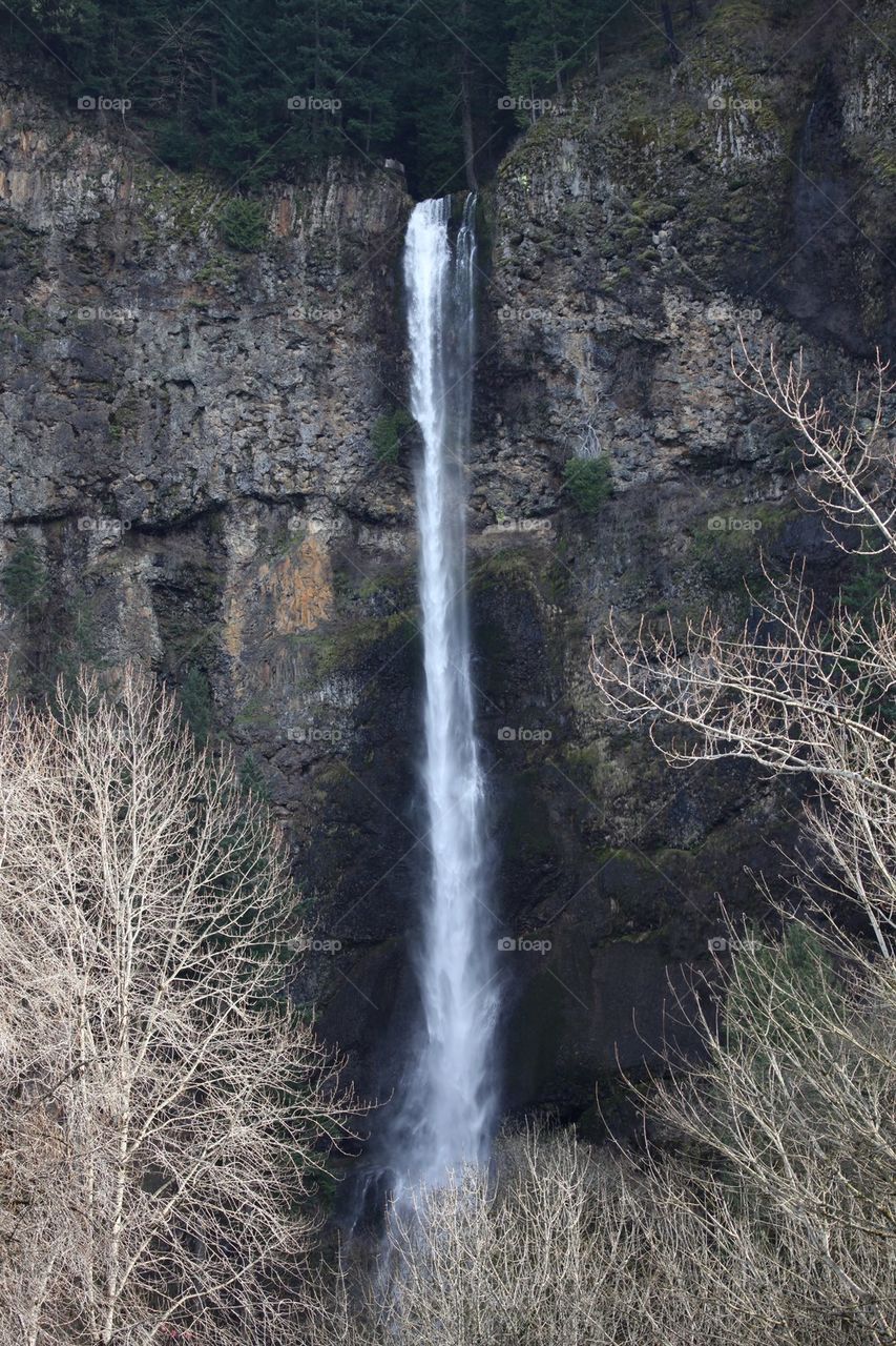 View of waterfall through rocky mountain