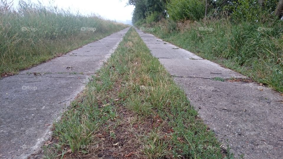 long path at cloudy day