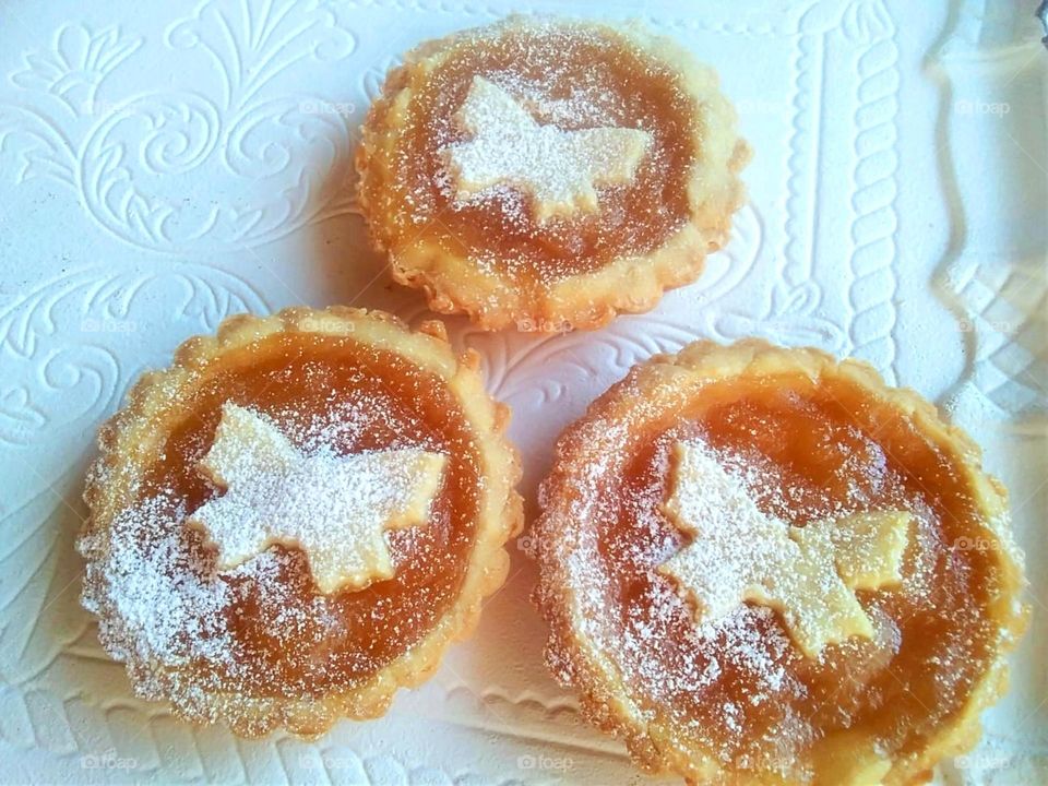 Homemade butterfly- themed crostatine with jam