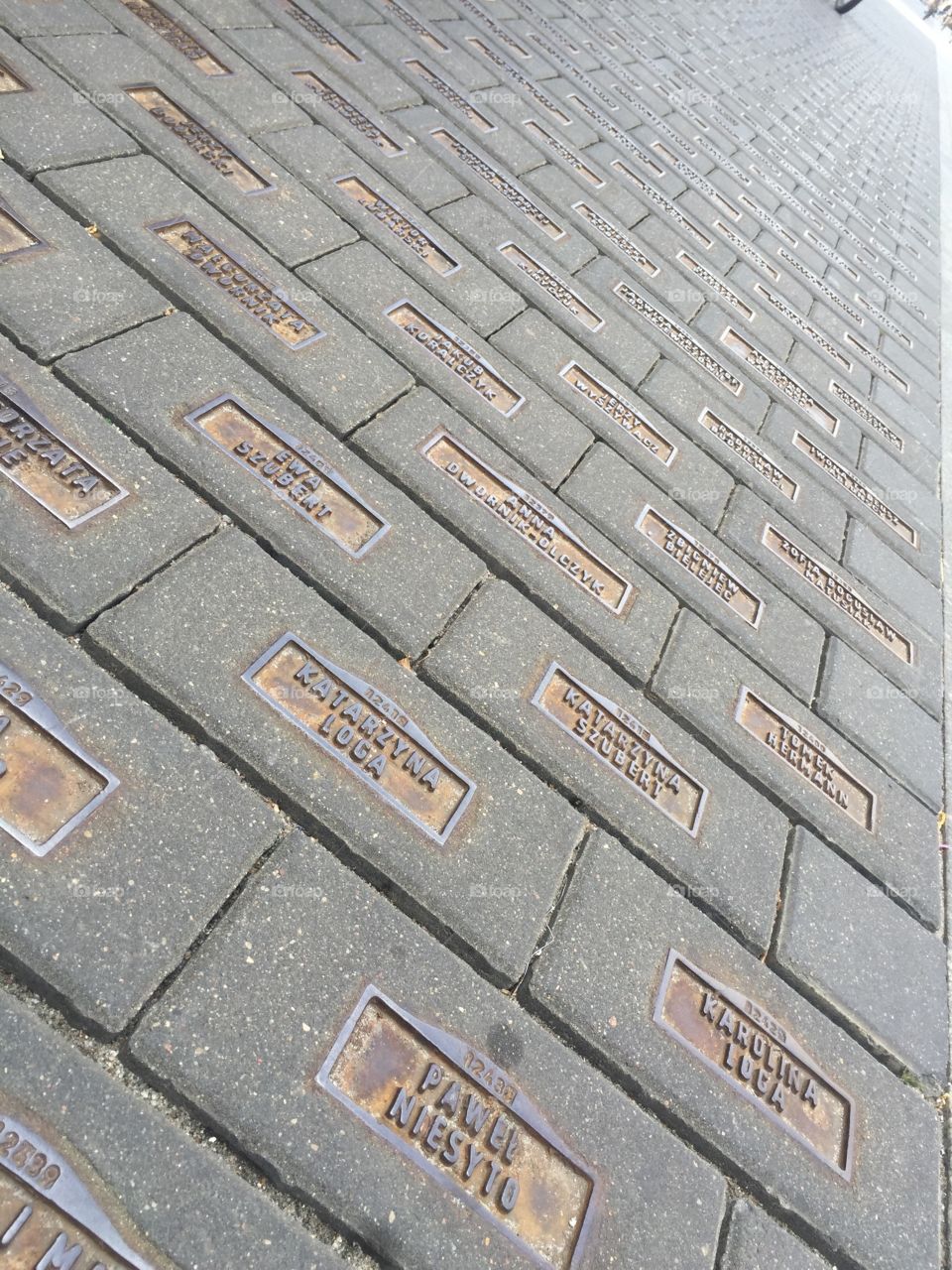 Memorial of names on the street in Lodz