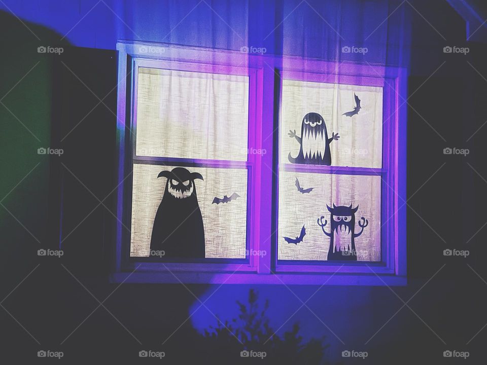 Monster silhouettes on some windowpanes 